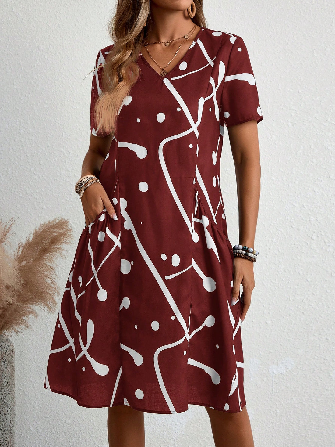 Effortlessly exude elegance with this women's casual vacation dress. Featuring a random print, its effortless style is perfect for any vacation. Stay comfortable and classy while making a statement. Perfect for any occasion, dress it up or down for a versatile look.