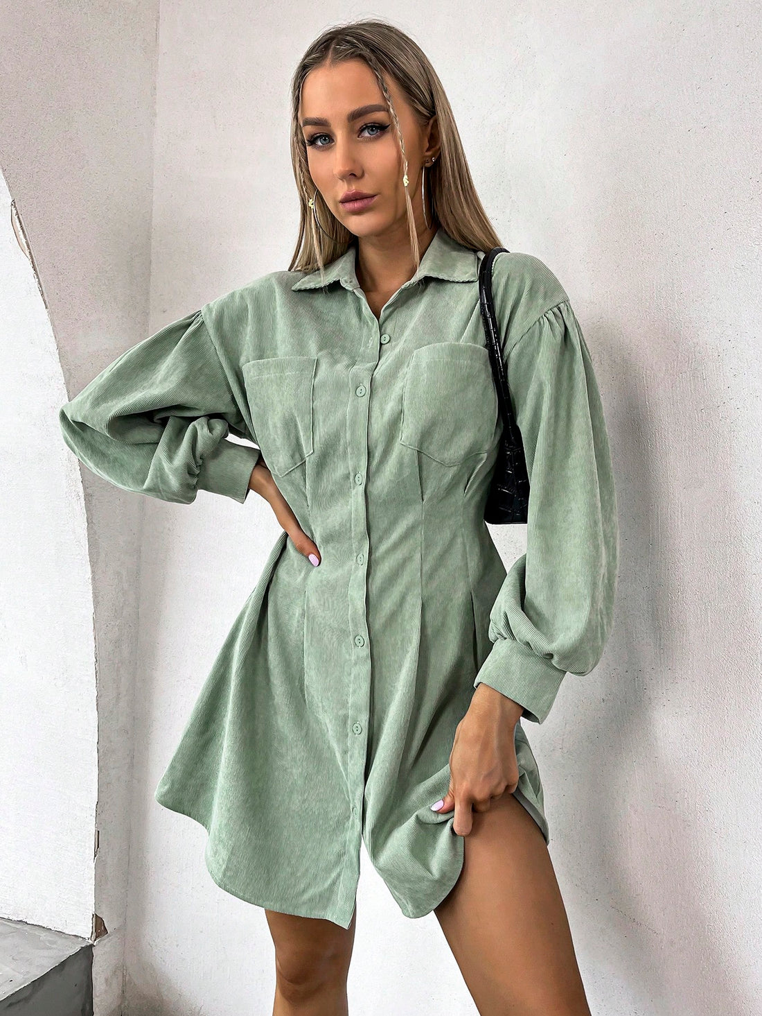 Step up your fashion game with our Effortless Style: Lantern Sleeve Cord Shirt Dress. This stylish dress features lantern sleeves and a plicated detail, making it a standout piece in any wardrobe. Its effortless style will have you looking and feeling confident all day long.