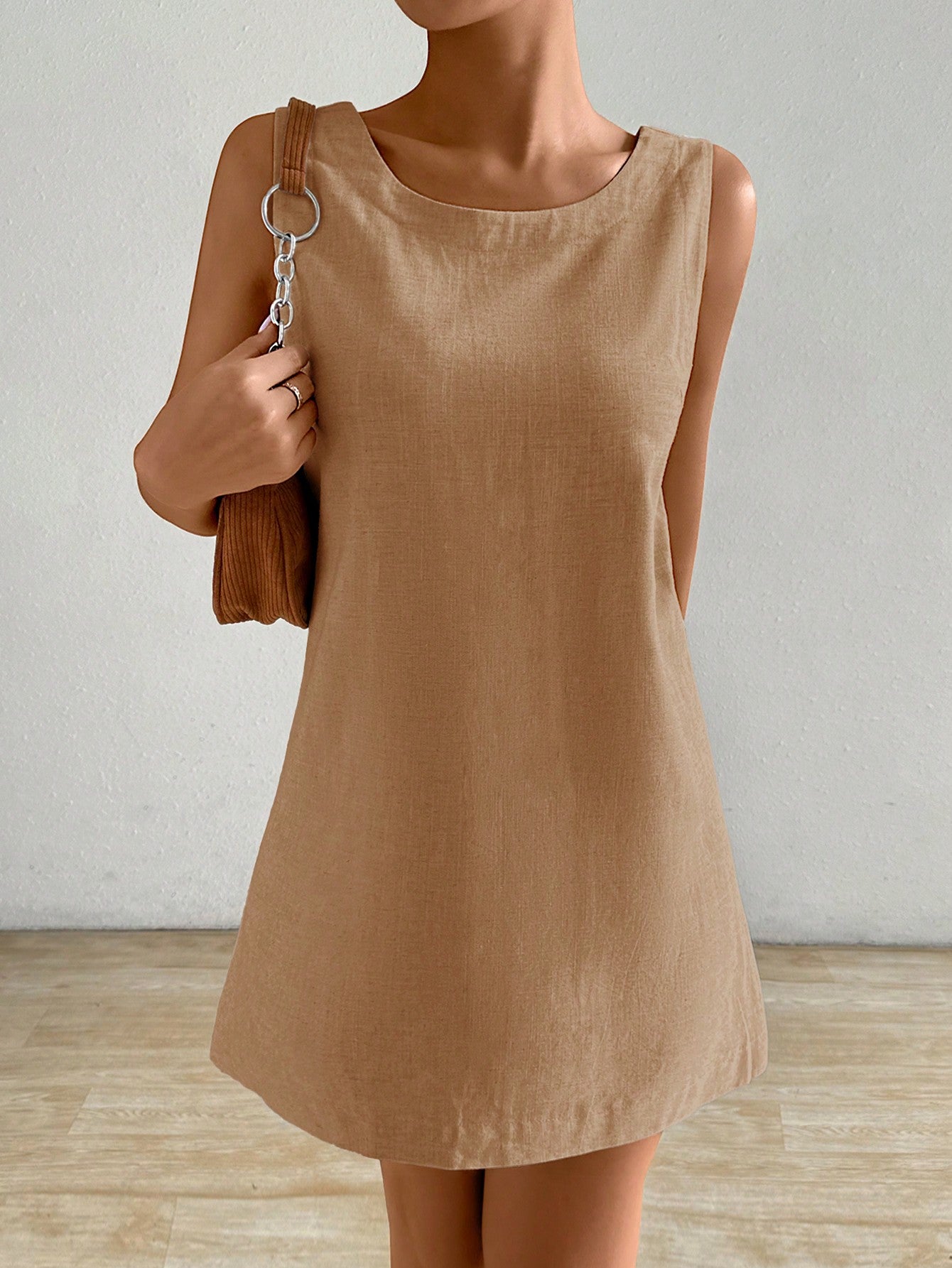 Stay cool and chic all summer long with this solid sleeveless tunic dress. Its breezy design keeps you comfortable while the versatile style makes it perfect for beach days, brunch dates, or casual strolls. Easy to dress up or down, this tunic is your go-to for effortless, sunny-day vibes.