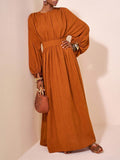Slip into the warm embrace of autumn with this brown maxi dress designed to turn heads whether you're strolling on a romantic getaway or simply owning your everyday style. Its flowing fabric moves with you, blending comfort and elegance effortlessly. Perfect for lazy brunches or sunset dinners, this dress adds a playful yet sophisticated touch to your wardrobe. Embrace the season and let your charm shine in every step.
