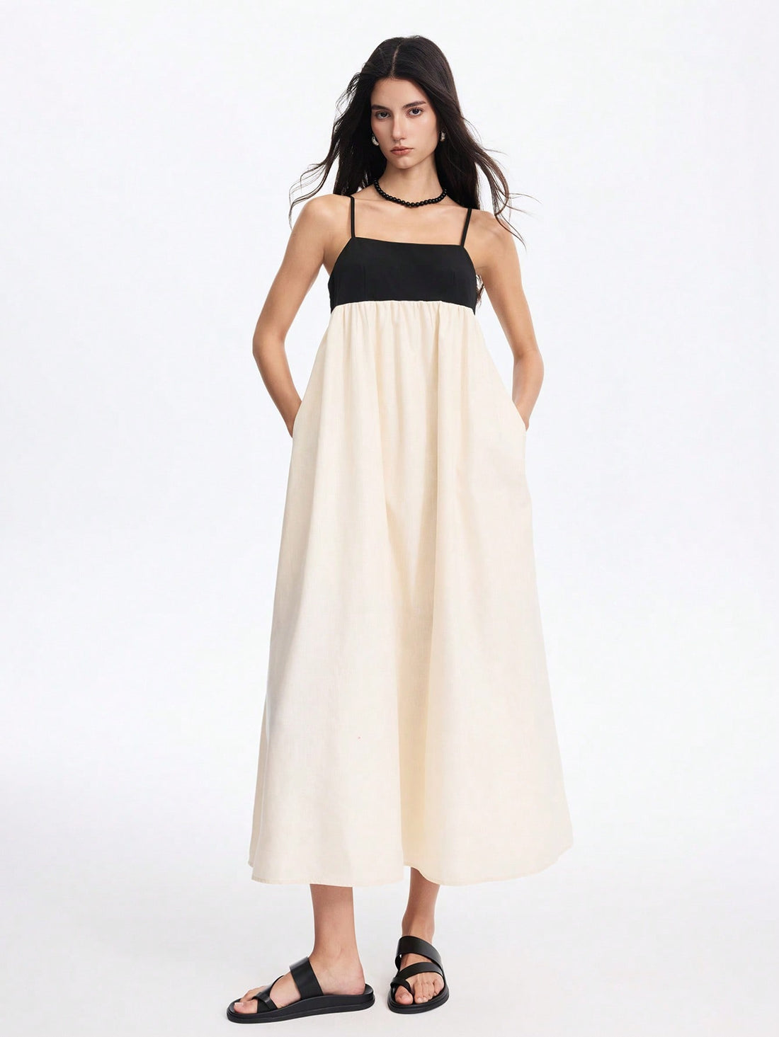 Step into sunshine with this effortlessly chic backless colorblocked maxi dress, designed to keep you cool and stylish all spring and summer. Its playful colorblocking adds a fun twist, while the backless design brings a breezy, vacation-ready vibe. Whether you're strolling the beach or running errands, this dress combines comfort and flair for everyday wear with a splash of adventure.