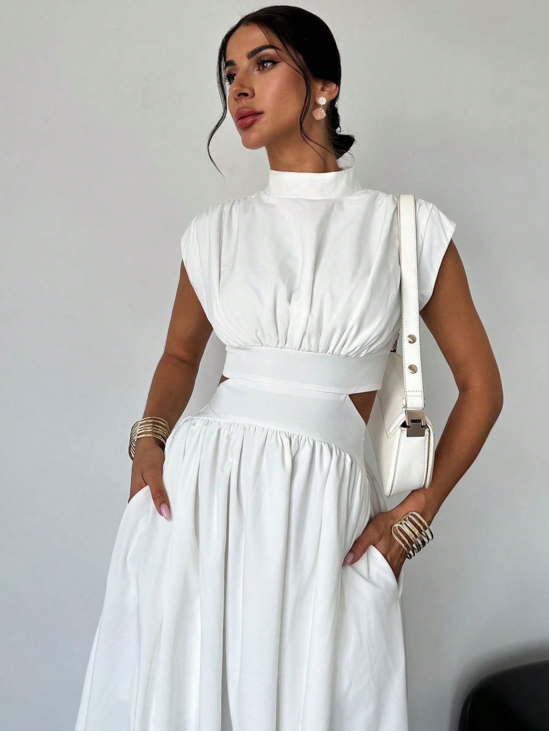 Introducing our Effortlessly Chic Hollow Pocket Midi Dress, the perfect blend of style and practicality. Featuring a classic and elegant design, this dress is perfect for any occasion. The hollow pockets add a unique touch, while the midi length adds a touch of sophistication. Elevate your everyday look with this must-have dress.