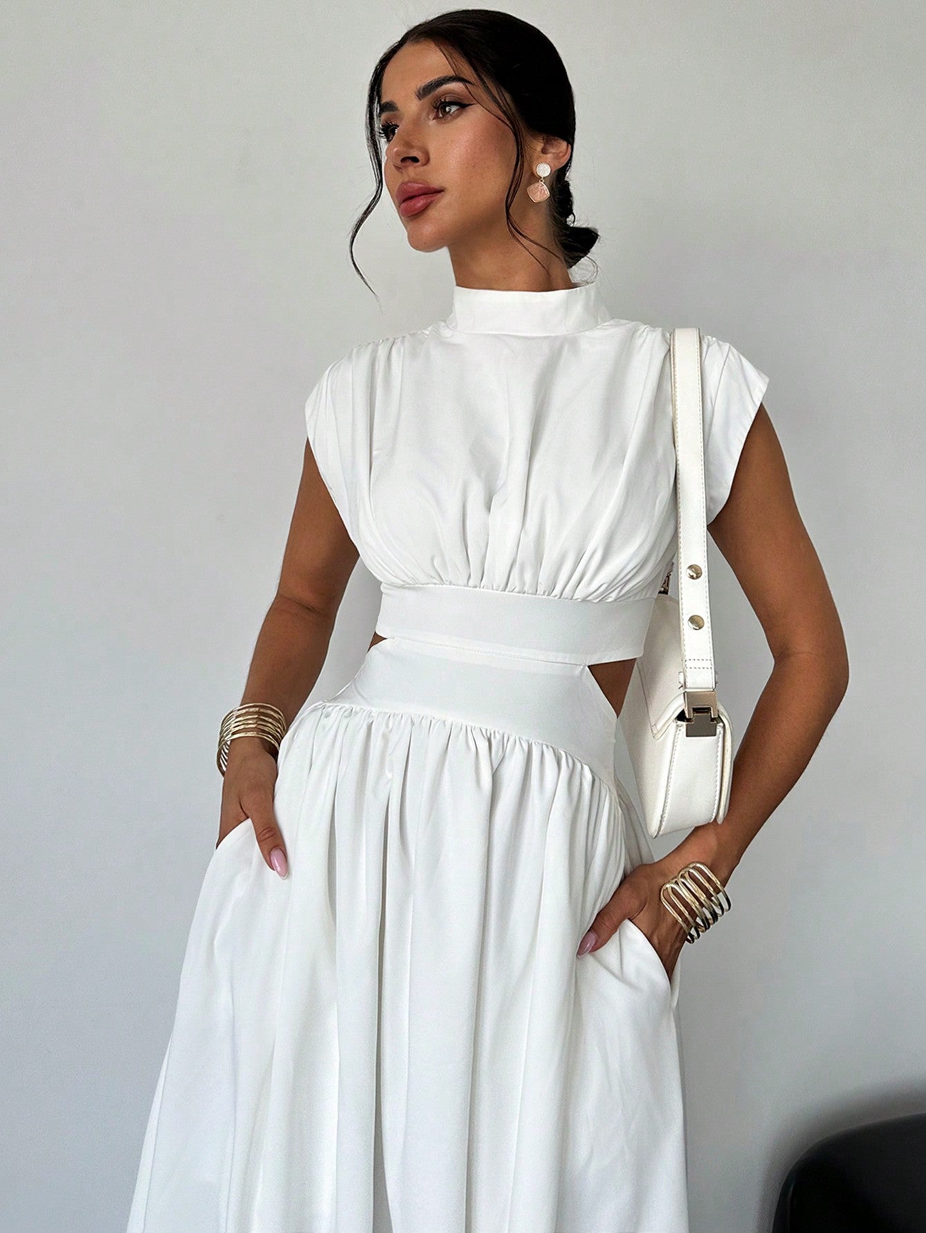 Introducing our Effortlessly Chic Hollow Pocket Midi Dress, the perfect blend of style and practicality. Featuring a classic and elegant design, this dress is perfect for any occasion. The hollow pockets add a unique touch, while the midi length adds a touch of sophistication. Elevate your everyday look with this must-have dress.