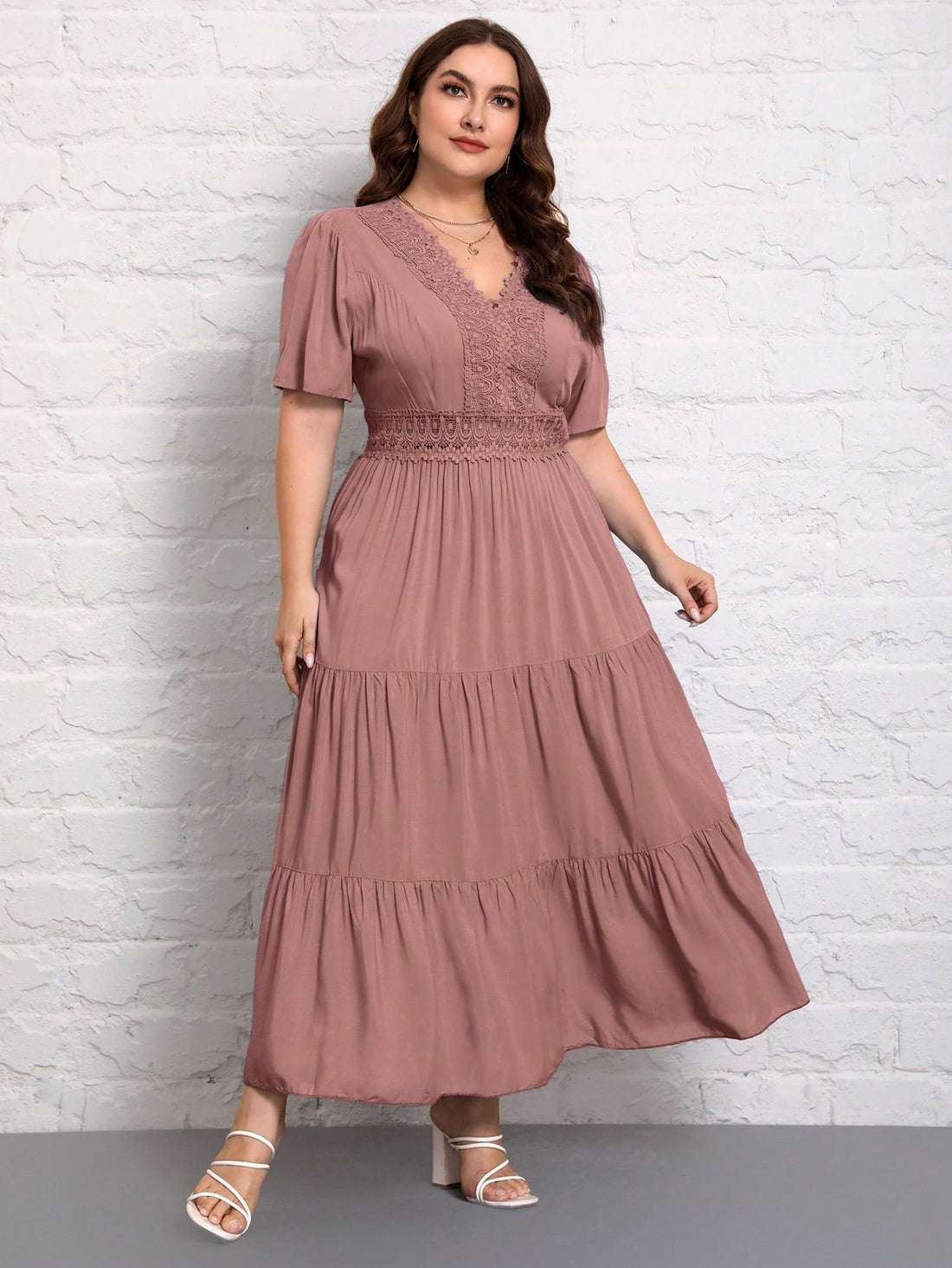 Effortlessly chic and stylish, this plus size dress will become your go-to choice for any occasion. The V-neckline accentuates your collarbone while the ruched hem adds a unique touch. Made of soft and comfortable fabric, this dress will keep you looking and feeling great all day long.