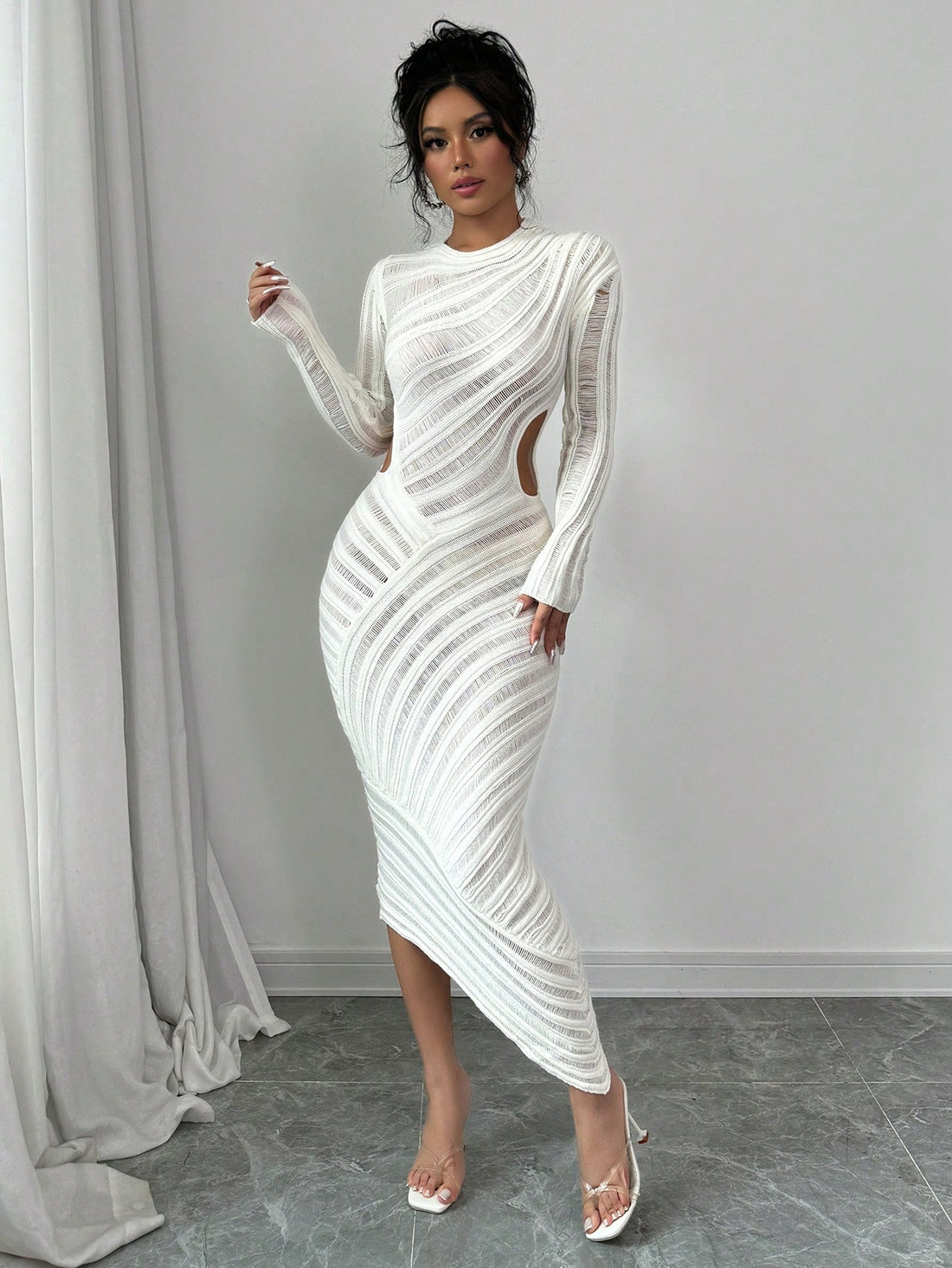 Effortlessly elevate your style with our Raffin Hollow-Out Long Sleeve Solid Color Dress. Its chic design and long sleeves provide both fashion and functionality. Made with high-quality materials, this dress exudes elegance and confidence. Perfect for any occasion, this dress is a must-have for a stylish and effortless look.