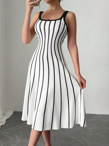 Get ready to turn heads with this effortlessly chic black and white striped dress! The loose-fit design and wide straps make it comfortable to wear all day long, while still looking stylish. Perfect for any occasion, this dress is a must-have for your wardrobe.