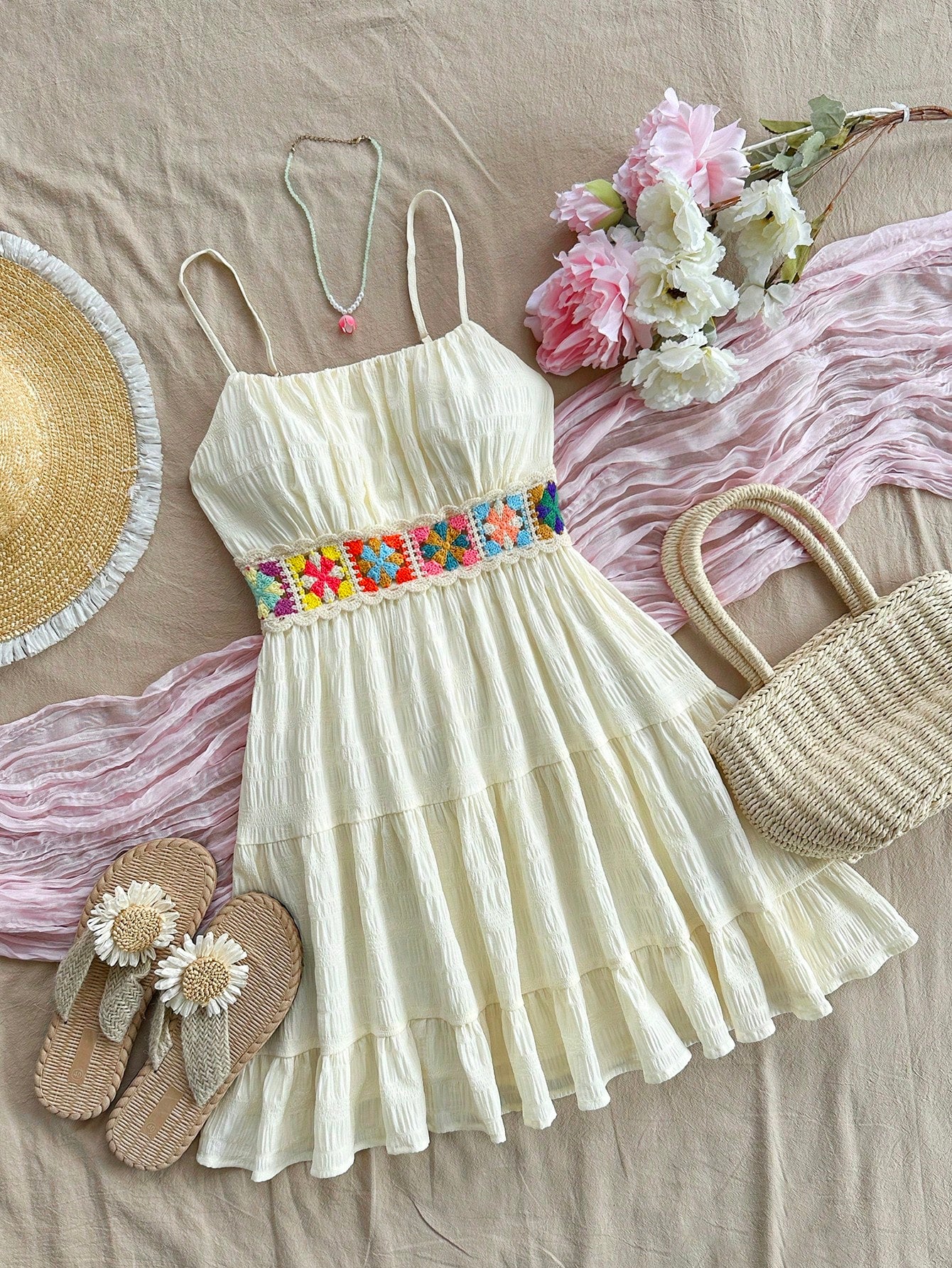 Add a touch of whimsy and retro charm to your summer wardrobe with our Effortlessly Chic dress. Featuring a flattering A-line silhouette and delicate crochet patchwork, this dress is perfect for any summer occasion. Bring a vintage-inspired flair to your style with this must-have dress.