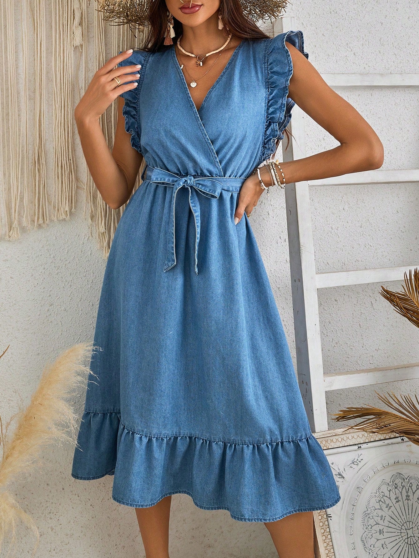 Stay stylish and comfortable on your next vacation with the Effortlessly Chic Denim Dress. The V-neck design and blue denim fabric create a classy, yet relaxed look, perfect for any destination. Designed with your ultimate comfort in mind, this dress is an essential addition to your travel wardrobe.