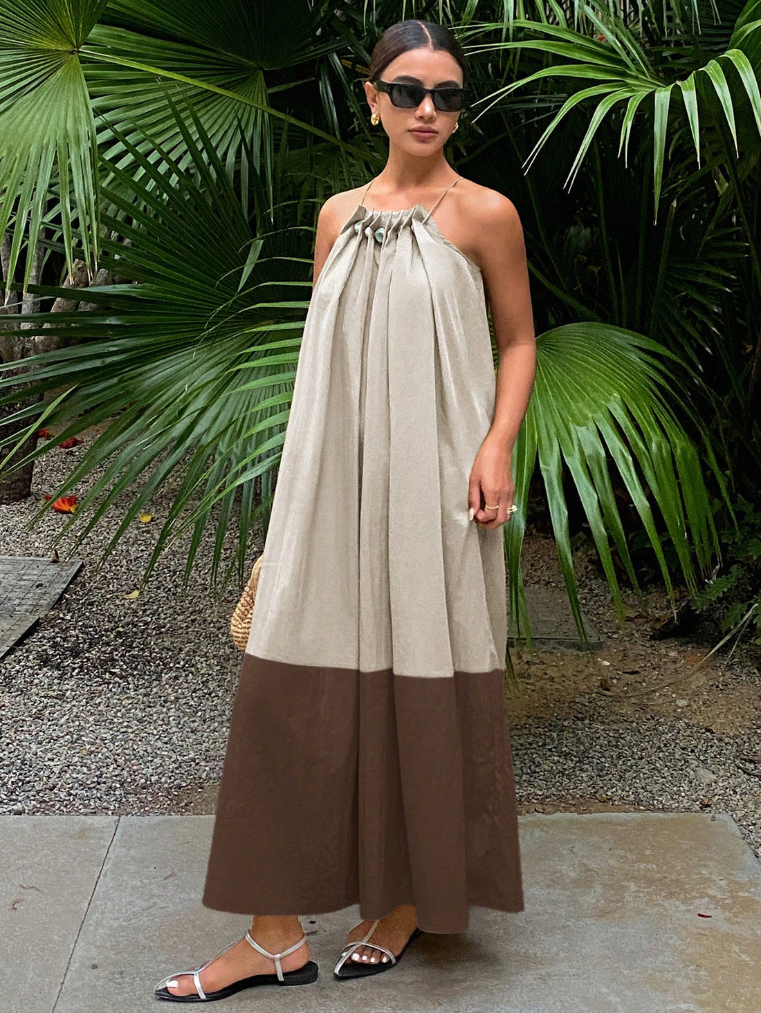 This breezy summer dress combines casual comfort with eye-catching style! The loose fit keeps you cool during hot days, while contrasting colors add a playful pop that turns heads. Adjustable spaghetti straps ensure the perfect fit, making this your go-to dress for beach days, brunches, or evening strolls. Pair with sandals or dress it up with accessories for an effortlessly chic look that's ready for any summer adventure!