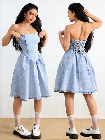 Effortlessly strut your style with this chic denim dress, featuring a criss-cross back and backless design. Perfect for a day out with the girls or a casual date night, this tube dress will have you looking and feeling your best. Say goodbye to boring outfits and hello to effortless chicness!