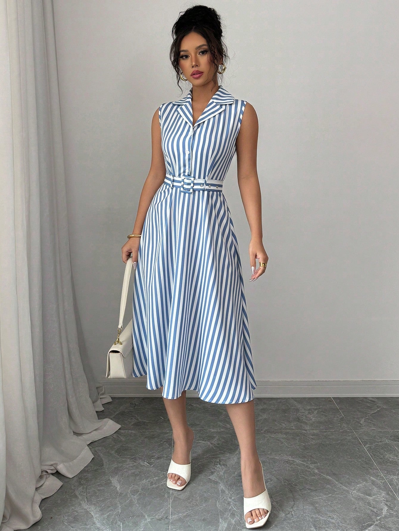 Unleash your effortless and chic style with our Women's Striped Sleeveless Mid-Length Summer Dress. Perfect for warm days, this dress offers a comfortable and stylish fit. Embrace your summer wardrobe with this must-have piece!