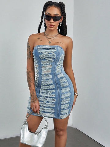 Get ready to turn heads in the Effortlessly Chic Women's Summer Patchwork Ripped Denim Tube Dress. This versatile dress combines style and comfort with its ripped denim design and tube silhouette. Perfect for any summer occasion, this dress will make you feel confident and fashionable!
