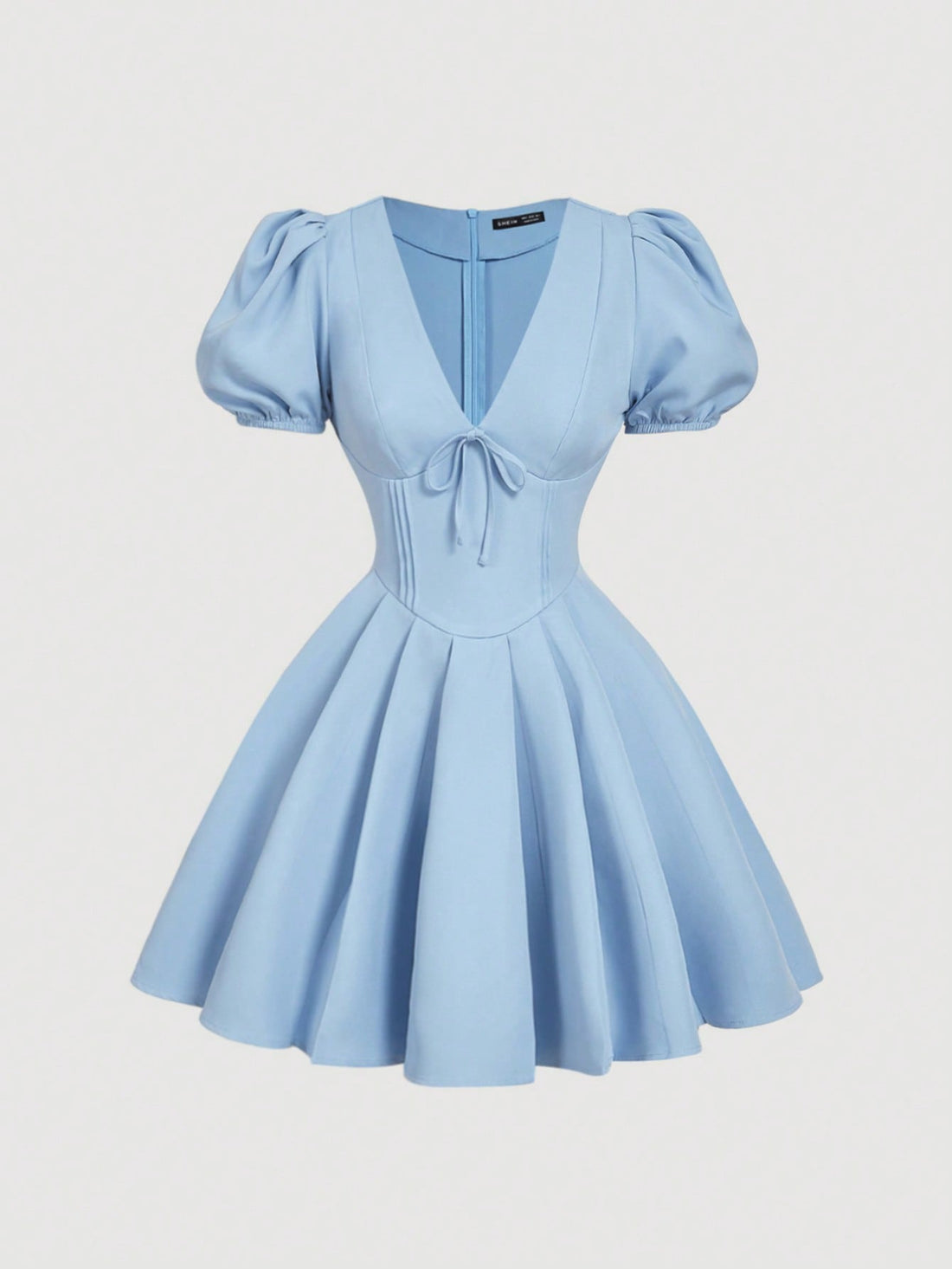 Be the belle of the ball in our Effortlessly Elegant Dress! Featuring a flattering v-neck and playful puff sleeves, this dress is perfect for any occasion. The charming bow detail adds a touch of whimsy to the lovely light blue color. You'll feel effortlessly elegant in this dress!