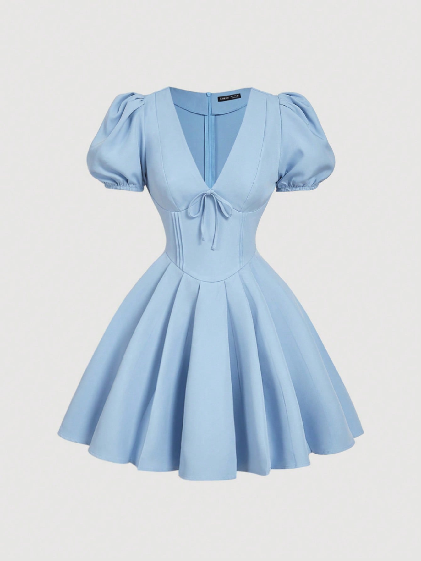 Be the belle of the ball in our Effortlessly Elegant Dress! Featuring a flattering v-neck and playful puff sleeves, this dress is perfect for any occasion. The charming bow detail adds a touch of whimsy to the lovely light blue color. You'll feel effortlessly elegant in this dress!