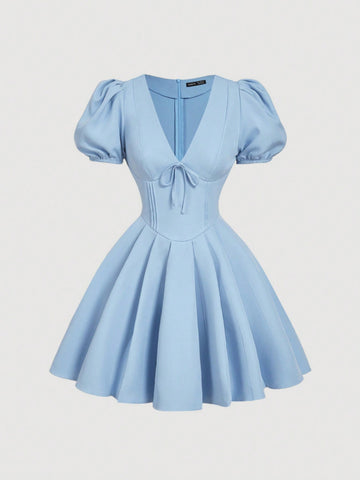 Be the belle of the ball in our Effortlessly Elegant Dress! Featuring a flattering v-neck and playful puff sleeves, this dress is perfect for any occasion. The charming bow detail adds a touch of whimsy to the lovely light blue color. You'll feel effortlessly elegant in this dress!