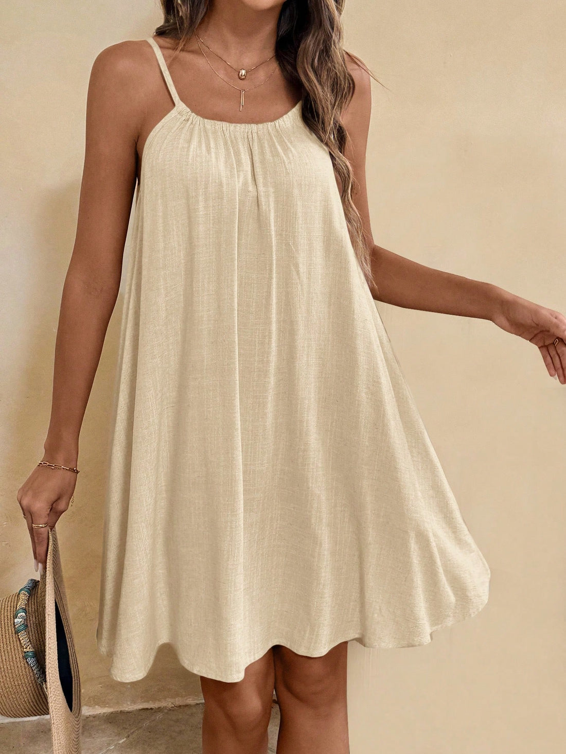 Effortlessly elevate your summer style with this flowy cami sundress. With a boho-inspired design, this babydoll dress is perfect for any occasion. Stay cool and chic all season long in this effortlessly elegant piece.