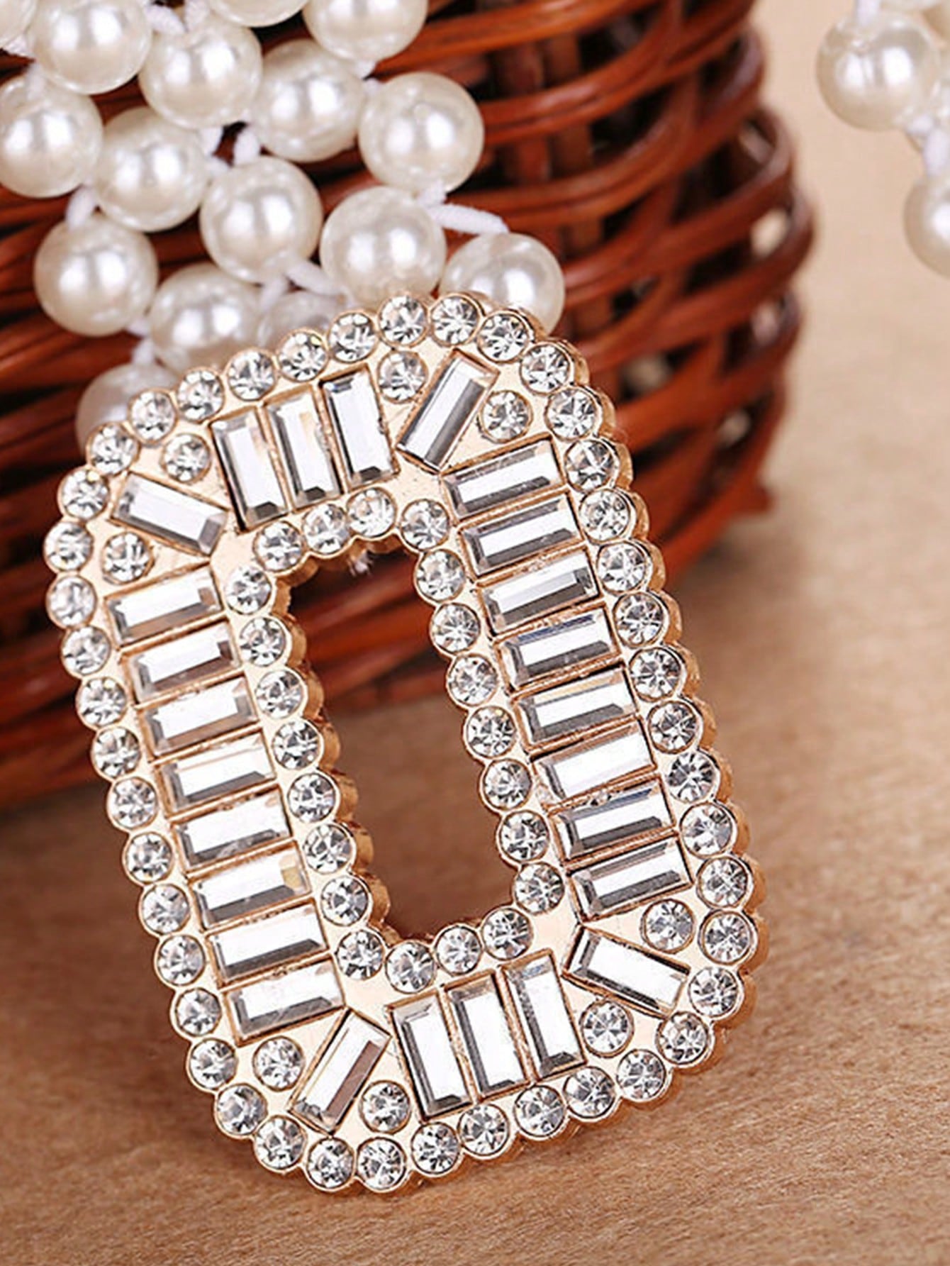 Upgrade your style with our Elegance Redefined Pearl Belt for women. This beautiful piece features a dazzling diamond square buckle that adds a touch of sophistication and glamour to any outfit. Elevate your look with the timeless elegance of pearls and the sparkle of diamonds. Perfect for any occasion.