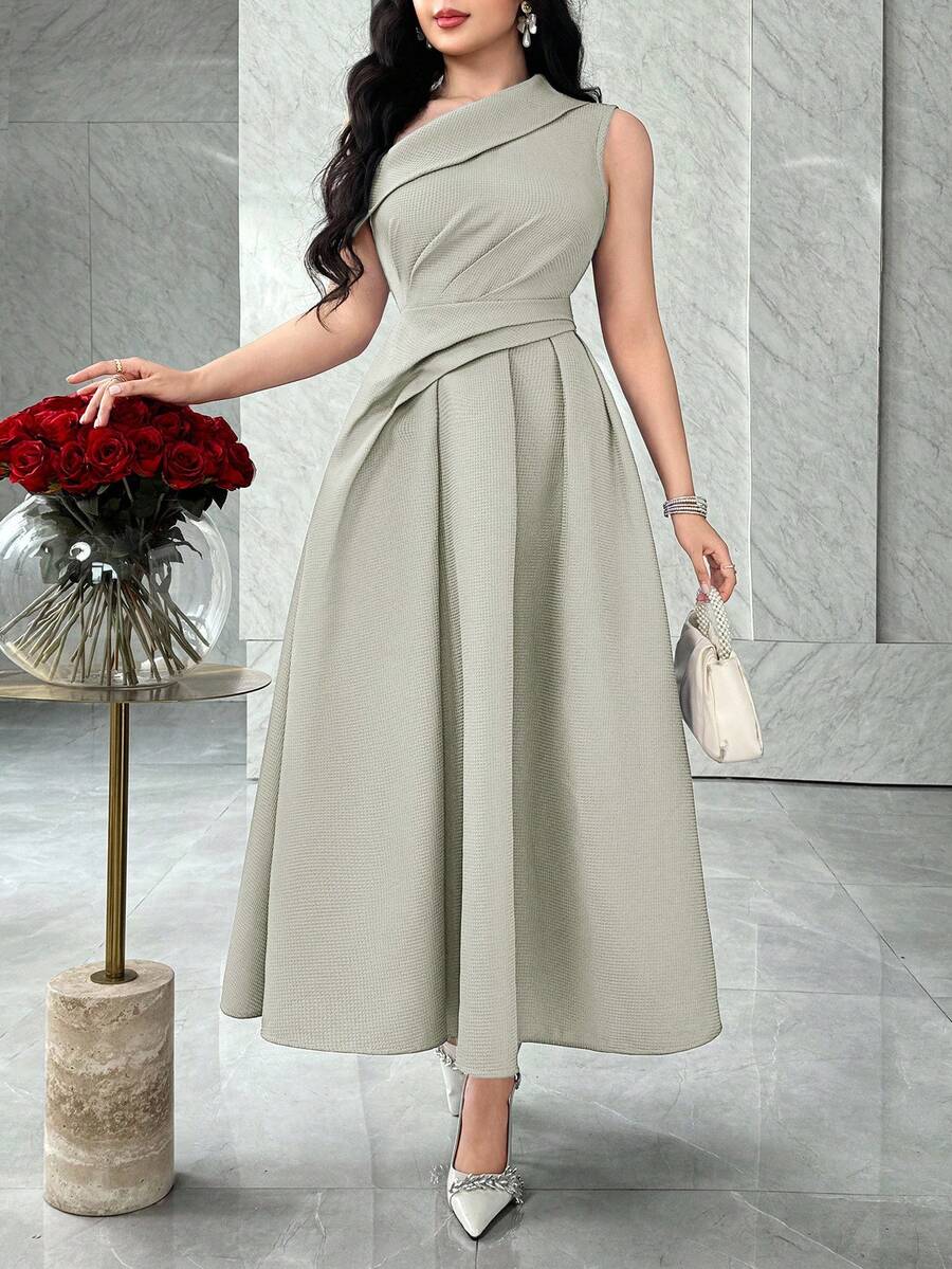 Front view of sage green asymmetric ruched A-line midi dress in marble interior