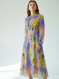 Capture the essence of timeless romance with this elegant A-line midi dress, featuring a sophisticated pleated front and graceful lantern sleeves that evoke a classic retro French aesthetic. Crafted from lightweight blue floral chiffon, the delicate botanical print and flowing silhouette create an ethereal movement perfect for garden parties or romantic strolls. The cinched waist and modest midi length offer a flattering fit for all figures, while the sheer textured fabric adds a touch of vintage-inspired l