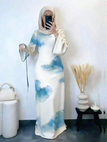 Elevate your modest wardrobe with this stunning Elegant Abstract Print Abaya Dress, designed for the modern woman who values both style and grace. Featuring a flattering round neckline and eye-catching all-over abstract print, this piece effortlessly transitions from daily wear to special occasions. The flared long sleeves add an elegant touch while maintaining the modest aesthetic you love. 
