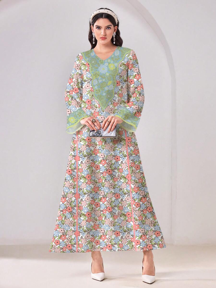 Embrace modest elegance with the Al-Najma Casual Floral Print Arabic Dress. This sophisticated tunic features a delicate floral pattern in multicolor tones, perfect for formal occasions and festive celebrations. The V-neckline and natural waistline create a flattering silhouette, while the long sleeves and flowing loose fit provide comfort and grace. Crafted from a breathable woven fabric blend of 95% polyester and 5% elastane with medium stretch, this dress moves with you throughout your day. 