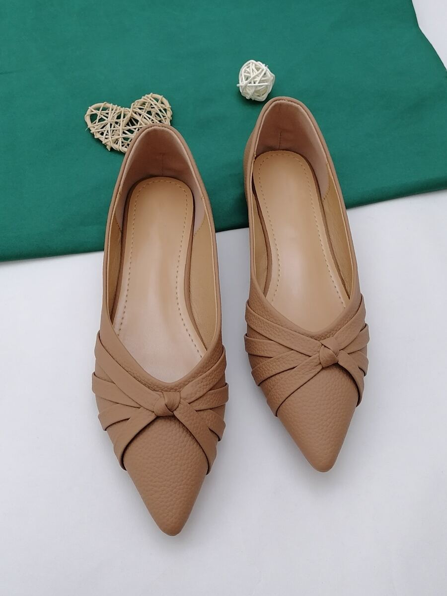 Slip into effortless style with these charming pointed-toe ballerina flats! The delicate criss-cross strap adds a touch of sophistication while keeping your feet secure and comfy all day long. Whether you're heading to the office, running errands, or meeting friends for coffee, these versatile flats transition seamlessly from season to season. The sleek silhouette flatters any outfit, from casual jeans to polished dresses. Say goodbye to uncomfortable shoes and hello to all-day confidence—because looking fa