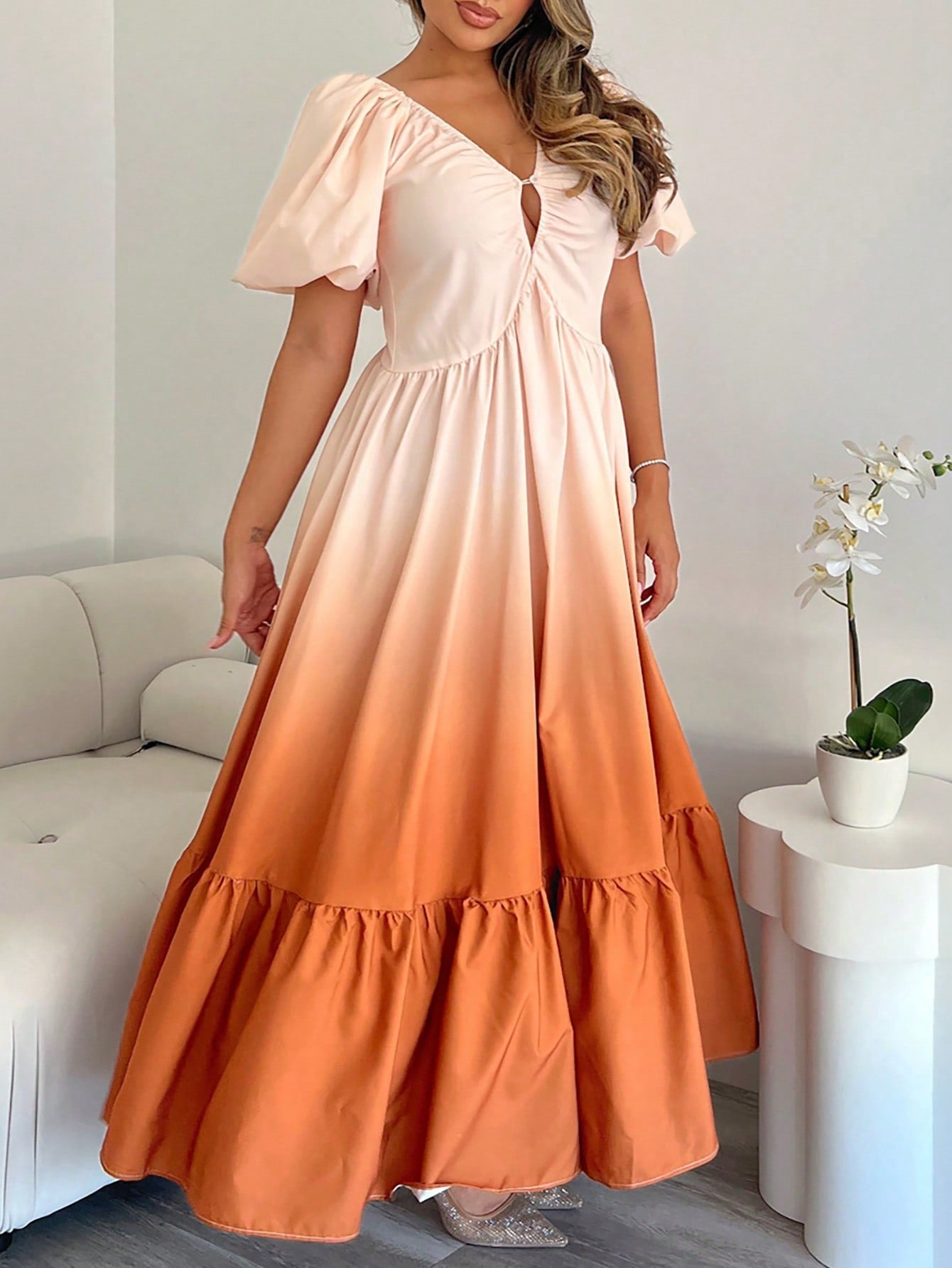 Turn heads this summer in our Elegant Apricot-Orange Gradient Maxi Dress. Featuring charming retro puff sleeves and a daring deep V-back, this dress blends vintage vibes with a fresh, playful twist. The smooth gradient from apricot to orange adds warmth and sunshine to your look, perfect for sunny days and breezy evenings. Flowy and flattering, it’s your go-to dress for effortless style and spirited summer fun.