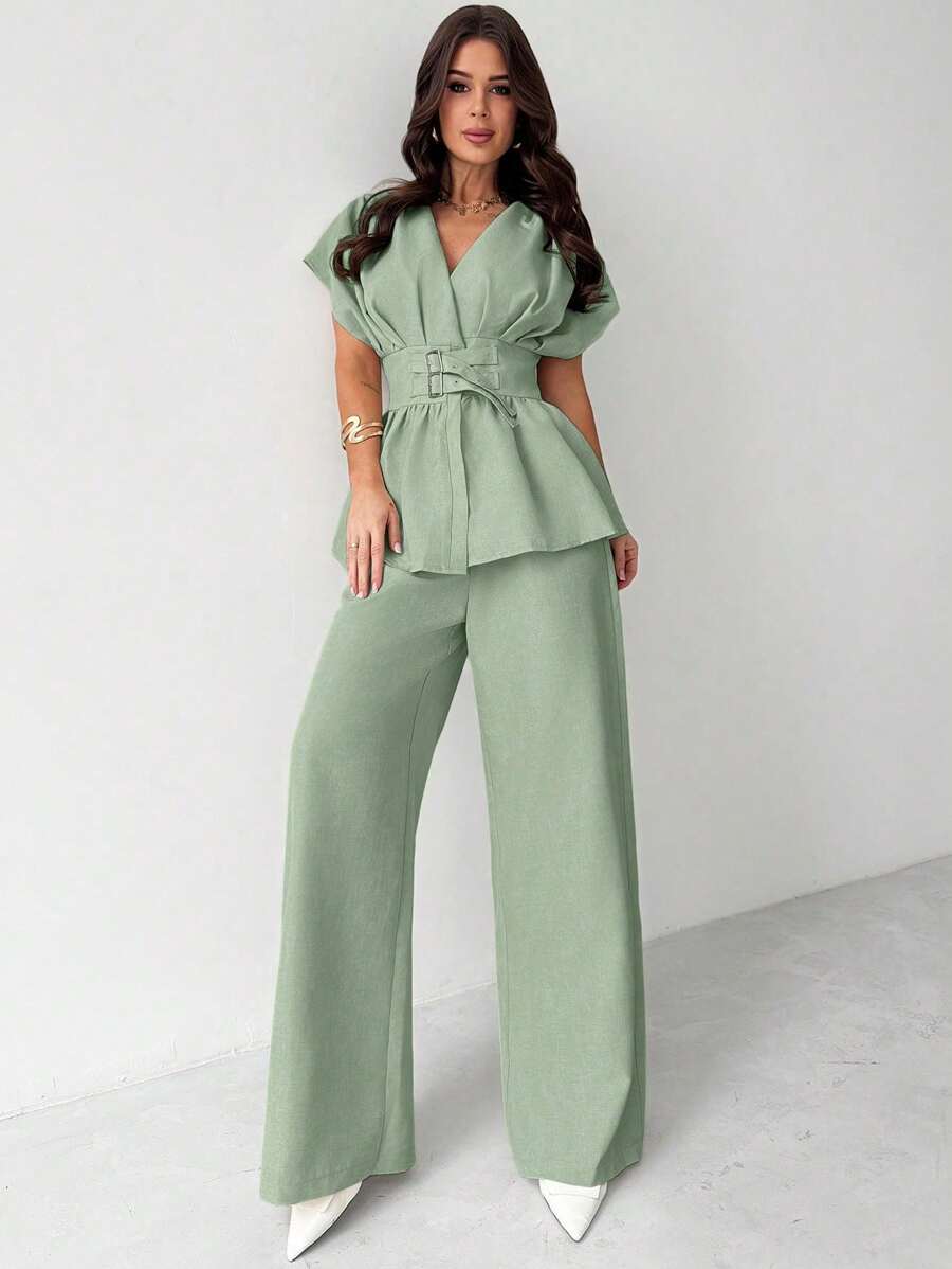 Elevate your spring and summer wardrobe with this sophisticated two-piece set. The apricot bamboo knit cardigan features a flattering V-neckline and batwing sleeves, perfect for layering over your favorite pieces. Pair it with the high-waist wide-leg pants for an effortlessly chic, office-ready look that transitions seamlessly from desk to dinner. Crafted from premium bamboo knit fabric, this set offers breathable comfort and an elegant drape. 