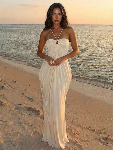 Captivate in this exquisite apricot halter dress, where timeless elegance meets modern allure. The strategically ruched bodice creates a flattering silhouette while the open back design delivers understated glamour. Ideal for summer weddings, romantic getaways, and intimate celebrations, this piece transitions seamlessly from day to evening. 