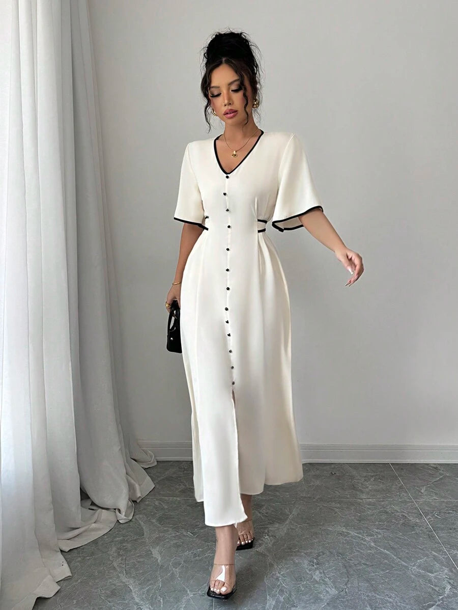 Elevate your vacation wardrobe with this sophisticated maxi dress, featuring a striking apricot and black color-block design that commands attention. The voluminous ruffle sleeves add romantic movement and dimension, while the adjustable tie belt defines your silhouette with effortless elegance. Crafted for warm-weather getaways, this piece transitions seamlessly from beachside brunches to evening affairs. The flowing maxi length provides graceful coverage without sacrificing style, making it an essential i