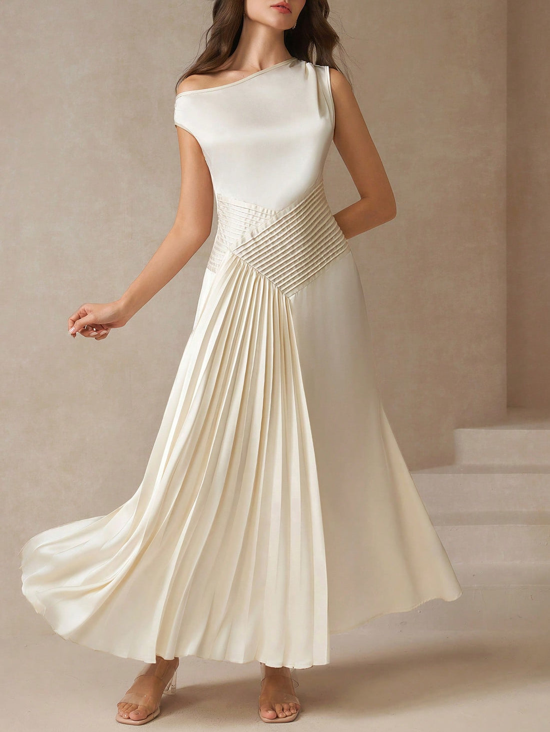 Step into the spotlight with this Elegant Asymmetric Pleated Ruched Dress—your perfect summer wedding or special occasion companion. Playful pleats dance across the silhouette, while the ruched details add a flirty touch. The asymmetric design keeps things fresh and fun, ensuring you turn heads wherever you go. Lightweight and breezy, it’s made to move with you from the ceremony to the dance floor with effortless charm.