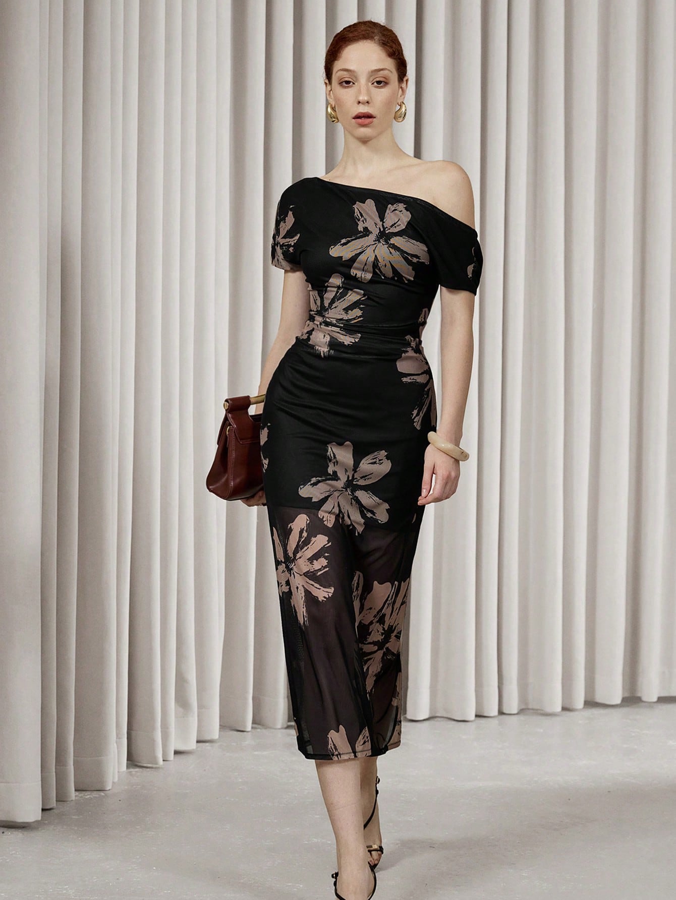 Be the center of attention with the Elegant Asymmetrical Floral Mesh Bodycon Dress by Aveloria Modichic. This stunning dress features a unique, asymmetrical design and beautiful floral mesh detailing that will surely turn heads. Perfect for any special occasion, this dress will make you feel confident and stylish.