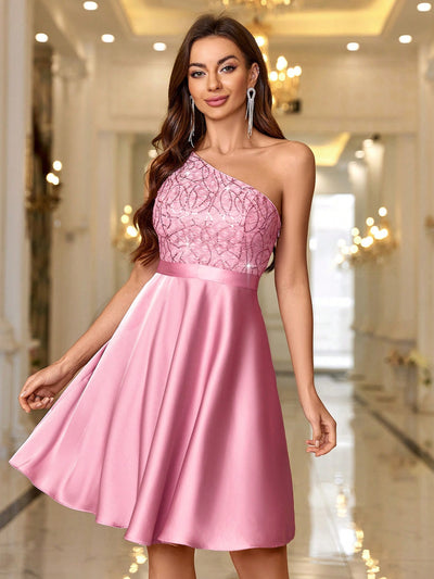 Expertly designed with an asymmetrical neck and delicate embroidery, this Elegant Cocktail Dress is perfect for any special occasion. The beaded tulle adds a touch of elegance and the flattering silhouette creates a stunning look. Make a statement with this beautifully crafted dress, perfect for formal events.