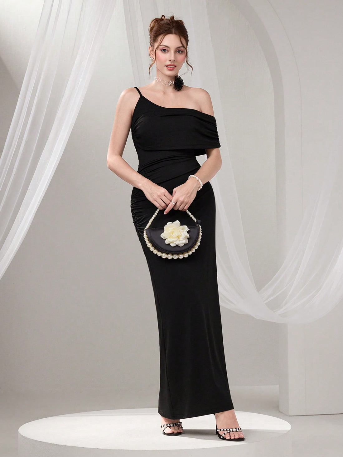 Slip into sophistication with this stunning asymmetrical neck maxi dress that's ready to turn heads at your next big event. The graceful draped neckline creates an effortlessly chic silhouette, while intricate beading adds just the right amount of sparkle and glamour. Whether you're celebrating a graduation or dancing the night away at a cocktail party, this dress delivers elegance with a fun, flirty edge. The flowing maxi length flatters every figure and moves beautifully with you. A timeless piece that pr
