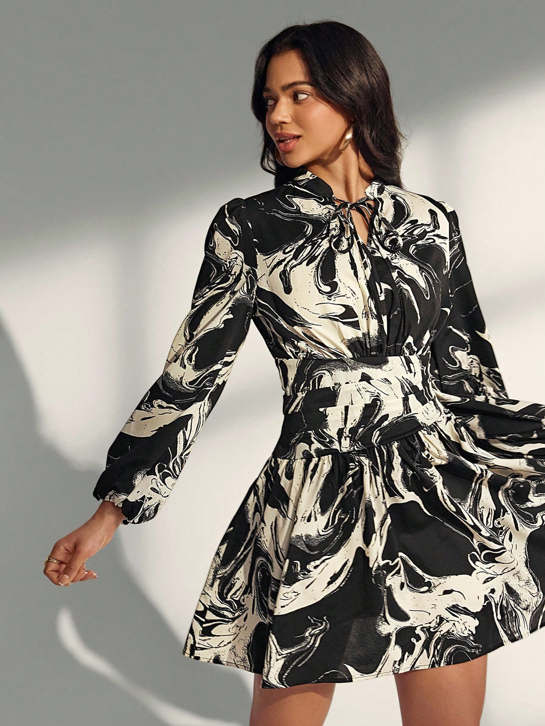 Embrace effortless sophistication with this striking asymmetrical printed dress that's perfect for transitioning into fall. The playful print adds personality while the minimalist silhouette keeps things chic and modern. Its unique hemline creates an eye-catching look that works equally well for casual outings or elevated occasions. Lightweight and flattering, this dress is your go-to piece for looking put-together without trying too hard. Style it with sneakers for a relaxed vibe or dress it up with heels 