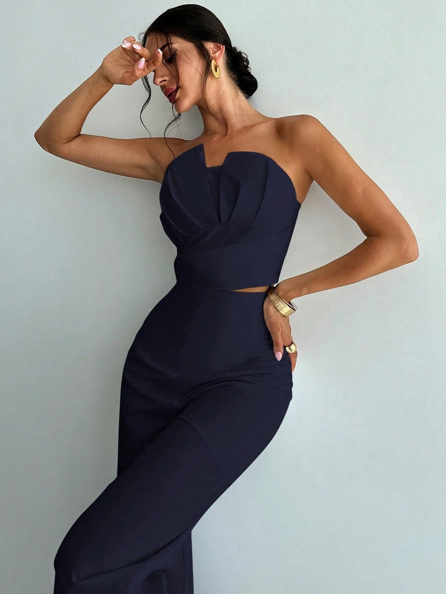 Make a statement in this chic two-piece set that's equal parts bold and effortless. The asymmetrical strapless crop top features a modern silhouette that flatters from every angle, while the high-waisted straight pants provide a sleek, elongating fit. Crafted entirely in crisp white, this pairing works beautifully for nights out, brunch dates, or whenever you want to serve pure sophistication with a playful edge. Mix, match, or wear together—this set is your new go-to for looking put-together without trying