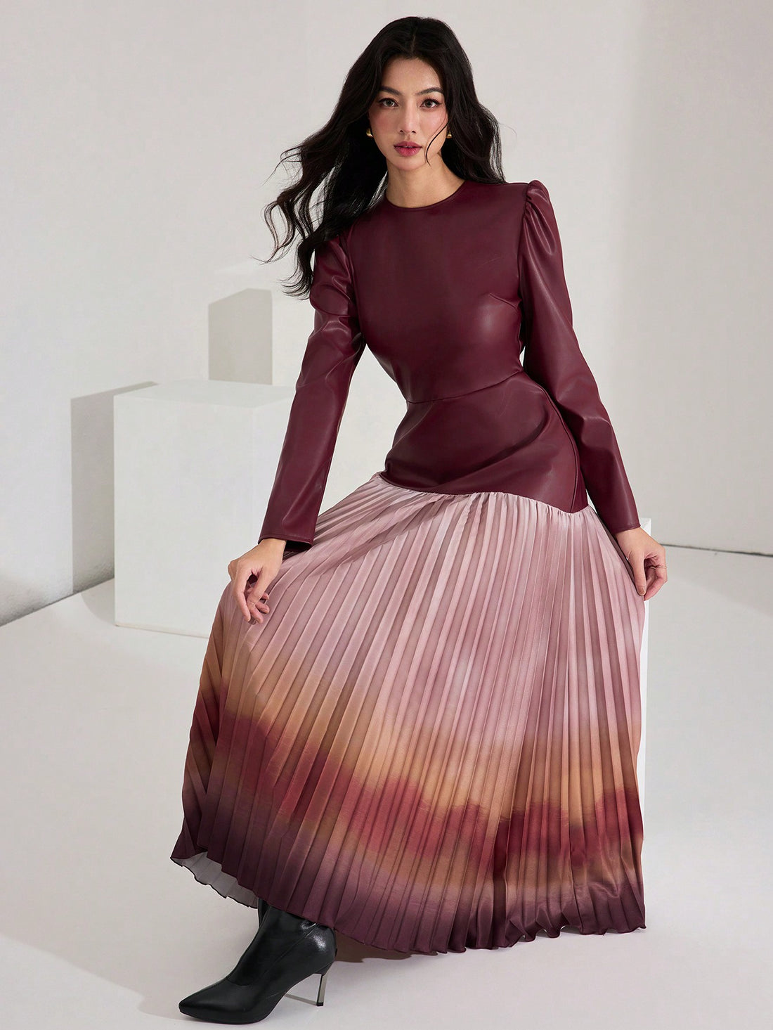 Step into autumn with flair in this Elegant Burgundy Leather Ombre Long Dress. Featuring a mesmerizing ombre effect and playful lantern sleeves, it’s designed to turn heads while keeping cozy. The pleated hem adds a touch of twirl-worthy charm, perfect for dancing through crisp fall evenings. Embrace warmth and style in one unforgettable statement piece.