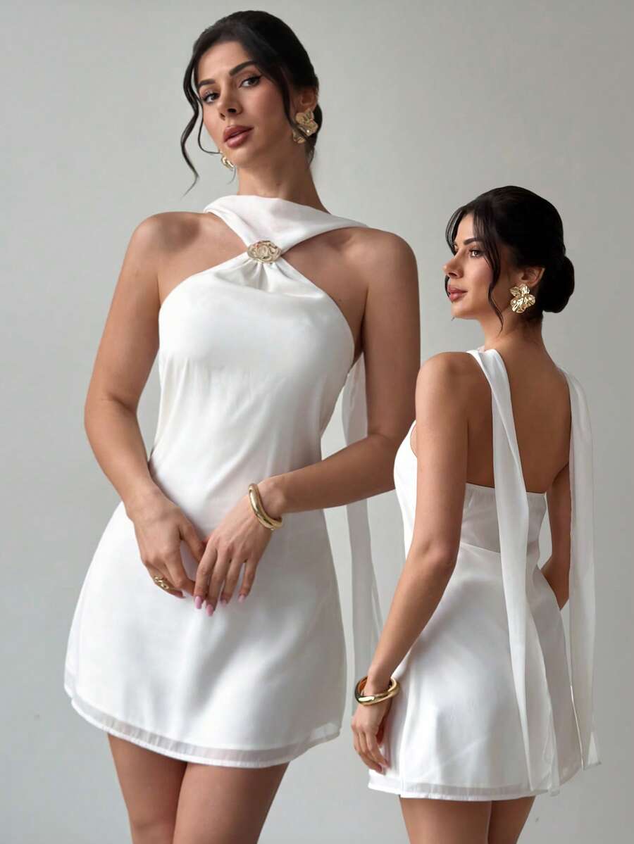 Effortless elegance meets summer style with this backless camisole dress. The minimalist silhouette features delicate straps and an open back design that catches the breeze, making it ideal for warm-weather adventures. Whether you're heading to the beach, a music festival, or a casual evening out, this versatile piece transitions seamlessly from day to night. Lightweight and comfortable, it's the perfect addition to your seasonal wardrobe.