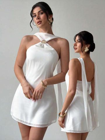 Effortless elegance meets summer style with this backless camisole dress. The minimalist silhouette features delicate straps and an open back design that catches the breeze, making it ideal for warm-weather adventures. Whether you're heading to the beach, a music festival, or a casual evening out, this versatile piece transitions seamlessly from day to night. Lightweight and comfortable, it's the perfect addition to your seasonal wardrobe.