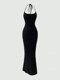 Turn heads with this Elegant Backless Halter Fishtail Dress, designed to make every special occasion unforgettable. Its sleek solid colors and daring backless cut add a flirty twist, while the fishtail silhouette gracefully highlights your curves. Perfect for dancing the night away or stealing the spotlight, this dress combines sophistication with a playful edge.