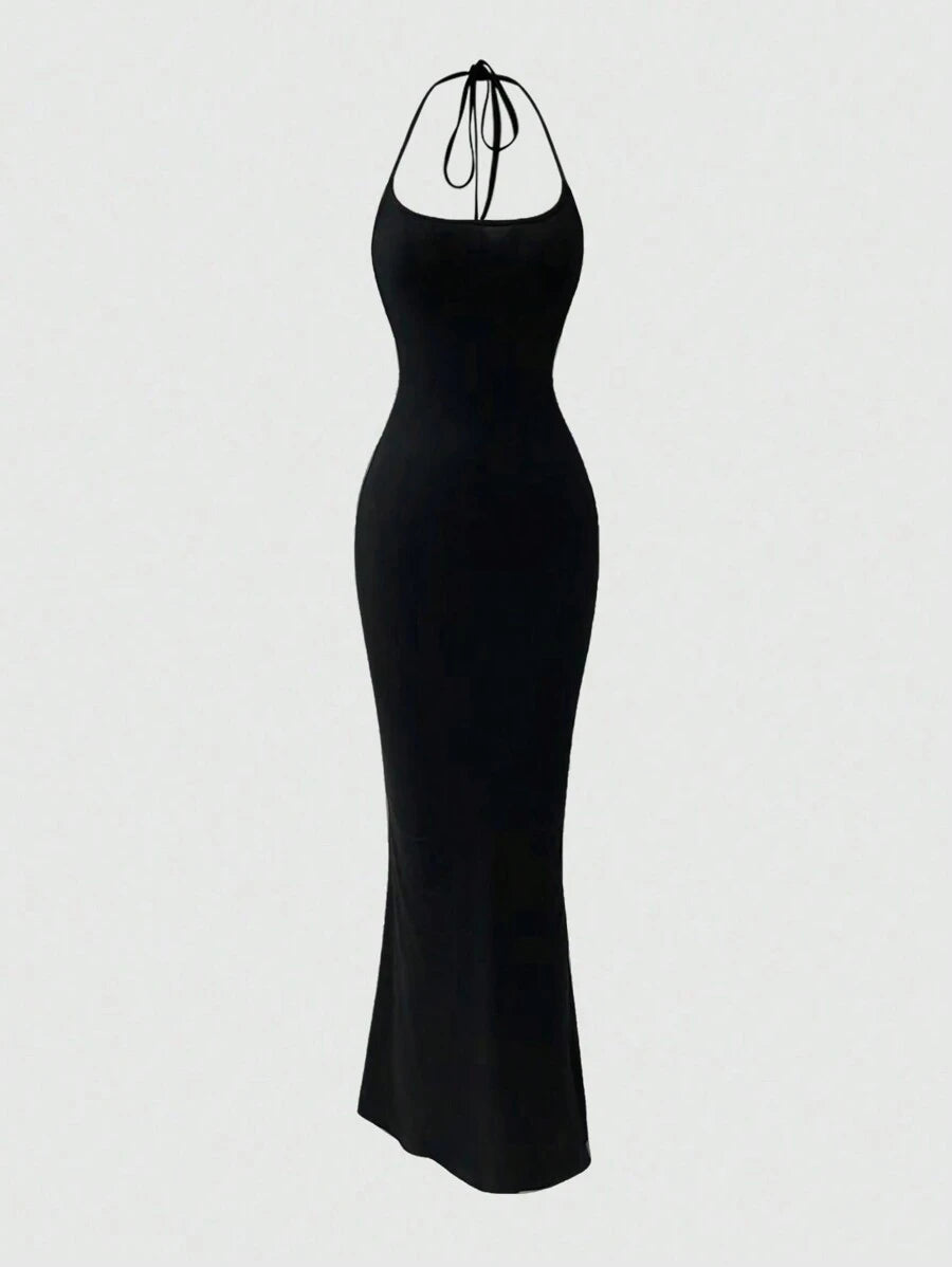 Turn heads with this Elegant Backless Halter Fishtail Dress, designed to make every special occasion unforgettable. Its sleek solid colors and daring backless cut add a flirty twist, while the fishtail silhouette gracefully highlights your curves. Perfect for dancing the night away or stealing the spotlight, this dress combines sophistication with a playful edge.