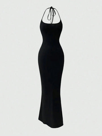 Turn heads with this Elegant Backless Halter Fishtail Dress, designed to make every special occasion unforgettable. Its sleek solid colors and daring backless cut add a flirty twist, while the fishtail silhouette gracefully highlights your curves. Perfect for dancing the night away or stealing the spotlight, this dress combines sophistication with a playful edge.