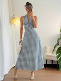 Step into style with our Elegant Backless Halter Long Dress! Featuring a classic black and white plaid design, this dress offers a stylish and comfortable fit. Perfect for any occasion, this dress is sure to turn heads and make you feel confident and chic. Get ready to stand out in this unique and playful piece!