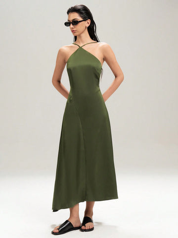 Turn heads this summer with this playful, elegant long dress featuring a backless halter neck and a flirty asymmetrical hem. Perfect for warm evenings, its flowing silhouette keeps you cool while adding a touch of chic sophistication to your look. Whether you're dancing under the stars or enjoying a sunset stroll, this dress brings effortless style and fun to every moment.