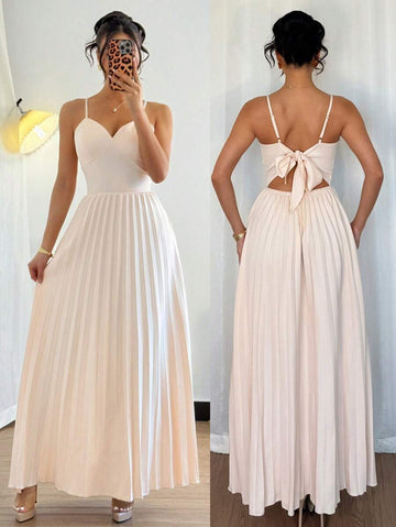 Let your playful and elegant fashion sense shine through with this elegant backless maxi slip dress for women. The pleated hem adds a stylish touch to this solid color dress, making it a versatile and fashionable choice for any occasion. Embrace your unique style with this must-have fashion item.