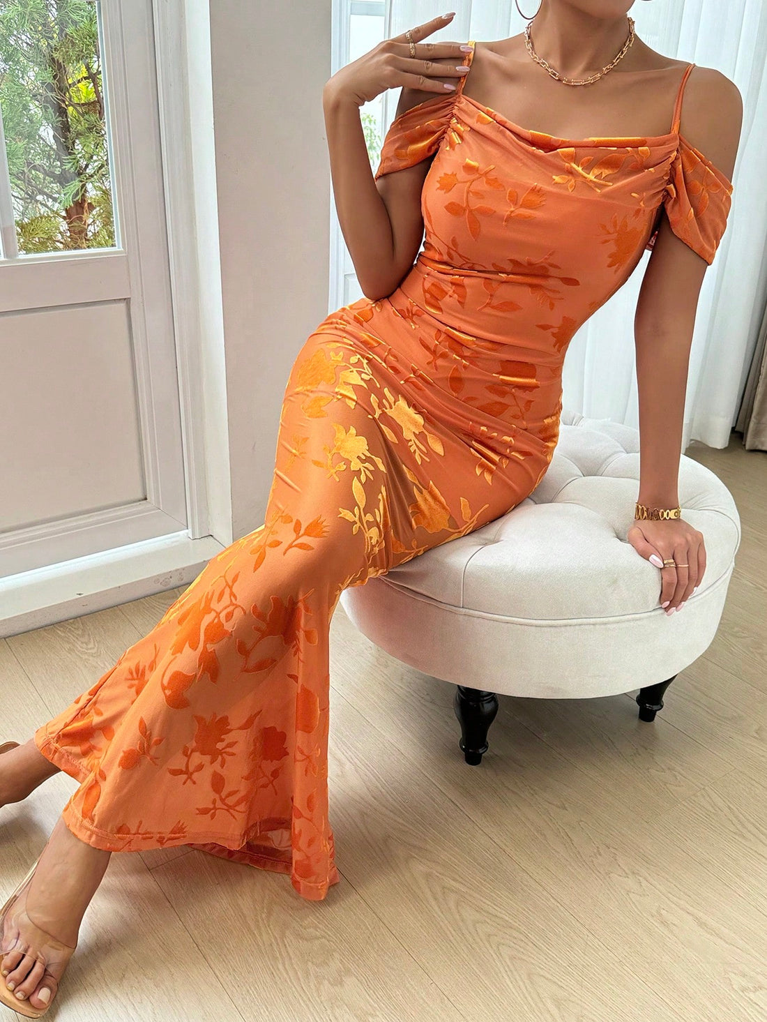 Turn heads in this stunning backless velvet burnout dress that's equal parts sophisticated and daring. The luxurious cowl collar drapes elegantly while the open back creates an alluring focal point perfect for special occasions. The mermaid hem hugs your curves beautifully, flowing into a dramatic flare that commands attention as you move. Crafted from sumptuous velvet with intricate burnout detailing, this dress is your ticket to feeling absolutely fabulous and unforgettably chic.