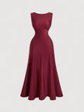 This stunning wine red evening dress is backless and features a unique bow tie detail, adding an elegant touch to any event. The open back design adds a touch of allure while the bow tie detail adds a playful touch. Perfect for a night out or special occasion.