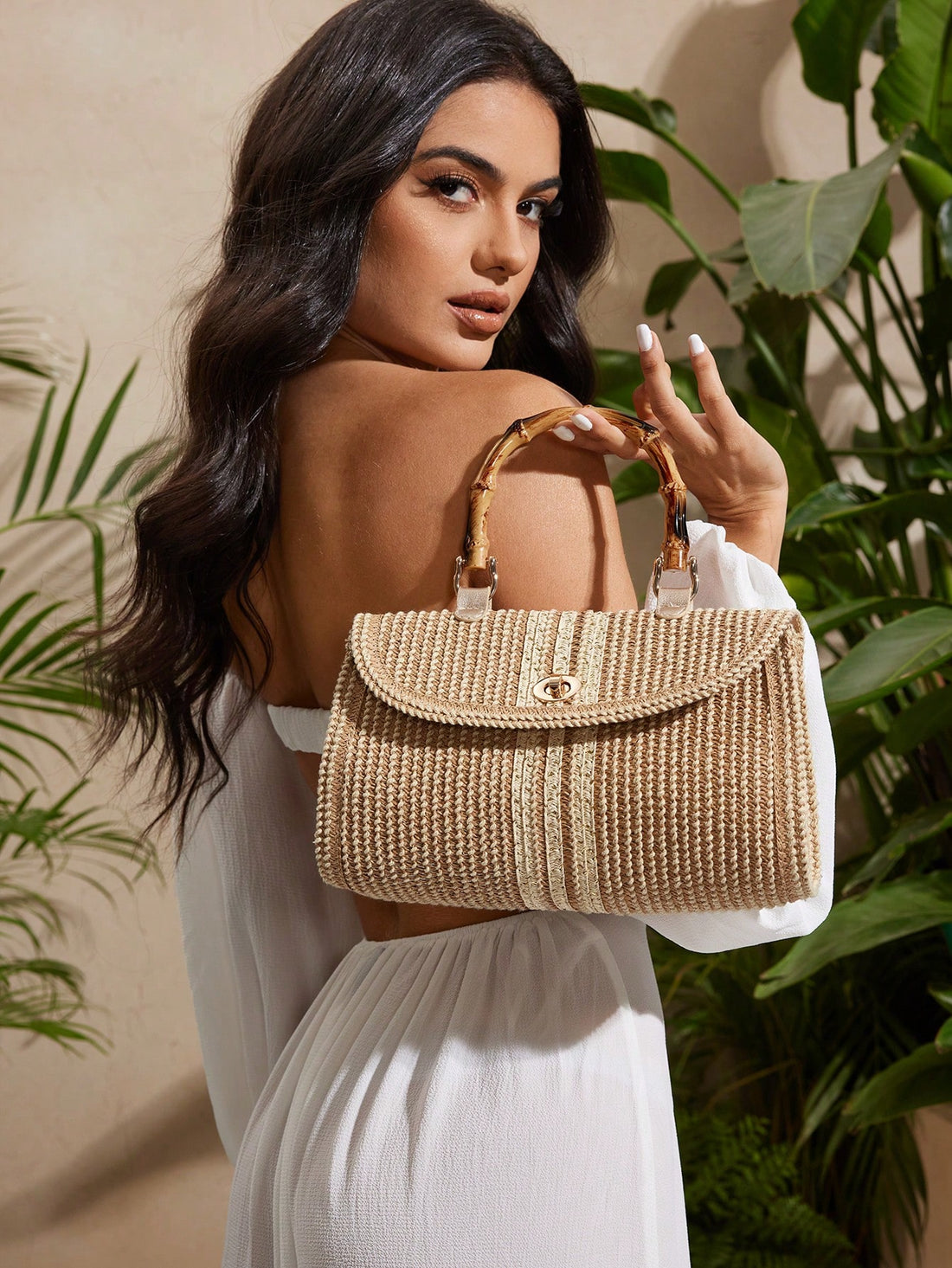 Capture the carefree spirit of summer with this Elegant Bamboo Handle Straw Bag. Its chic bamboo handles add a natural touch, while the versatile crossbody design keeps your hands free for exploring beachside markets or dancing at sunset. Lightweight yet spacious, it’s perfect for carrying all your sunny-day essentials with style and ease. Let this bag be your go-to companion for every sunny adventure!