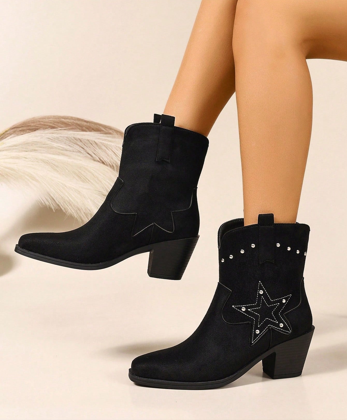 Step out in style with these Elegant Black Embroidered Chunky Heel Chelsea Boots. Perfect for vacation adventures, their bold chunky heel adds confidence while the intricate embroidery brings a touch of playful charm. Easy to slip on and versatile enough to pair with any outfit, these boots are your go-to for turning heads wherever you roam.
