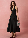 Get ready to turn heads in this elegant black halter neck A-line dress! Perfect for romantic occasions or everyday wear, this dress is sure to make you feel confident and stylish. With a flattering A-line silhouette and a classic halter neckline, this dress is a must-have addition to your wardrobe.
